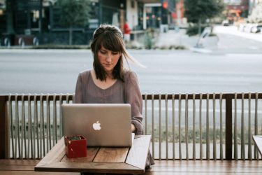 Woman writing on a laptop grow your accountancy