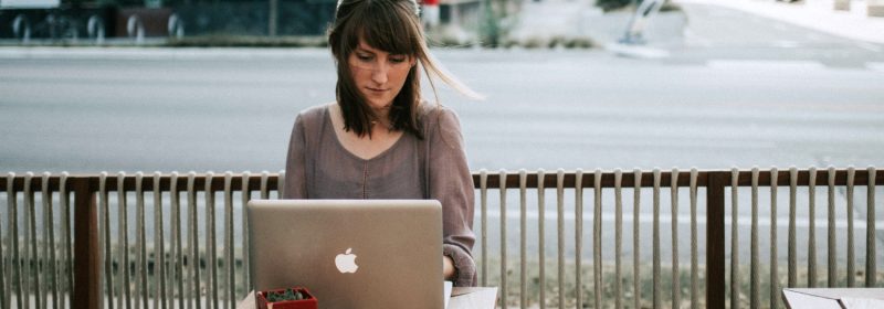 Woman writing on a laptop grow your accountancy