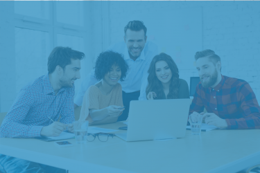 Headline image of happy people gathered around a computer